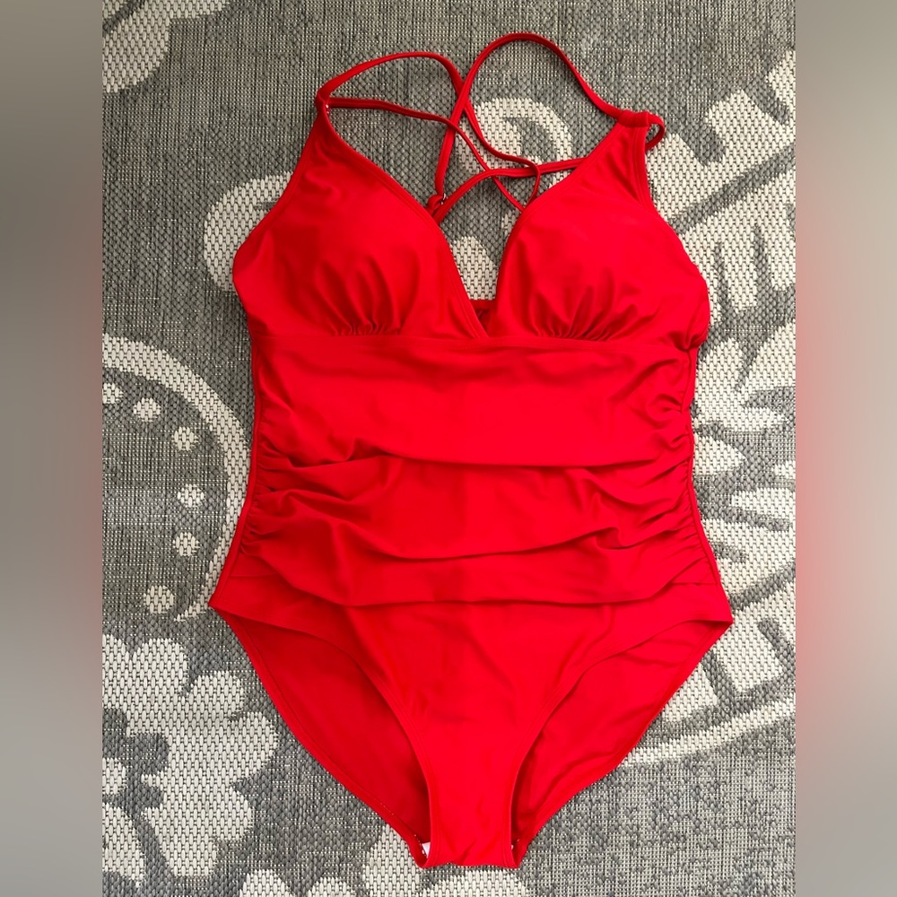 One piece red ruched swimsuit.  Tag has been removed.  Size Large